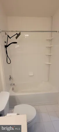 a bathroom with a shower and a bath tub