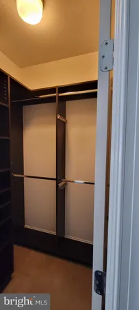a view of a refrigerator and a wooden floor