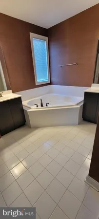 a bathroom with a bathtub and a sink