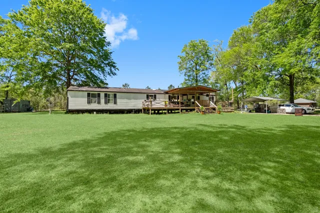 a view of a house with a big yard
