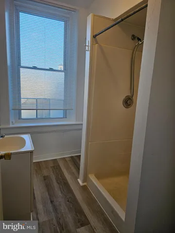 a bathroom with a bathtub and a shower