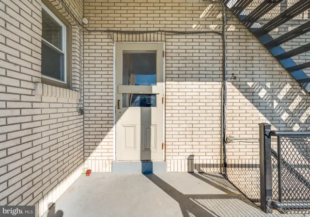 a view of a balcony with a floor to ceiling window