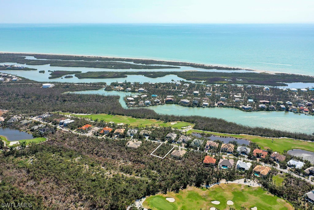 2356 Wulfert Road Sanibel, FL 33957 - Photo 20 of 23 a view of a lake with a mountain
