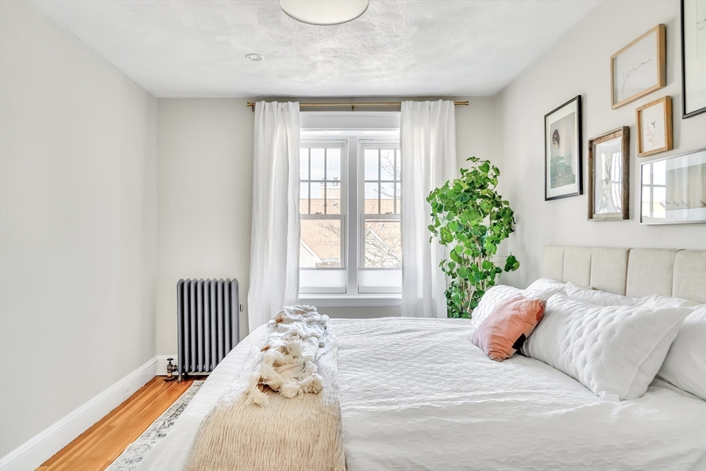 20 John Street, Unit 3 Brookline, MA 02446 - Photo 9 of 23 a bedroom with a bed and a window