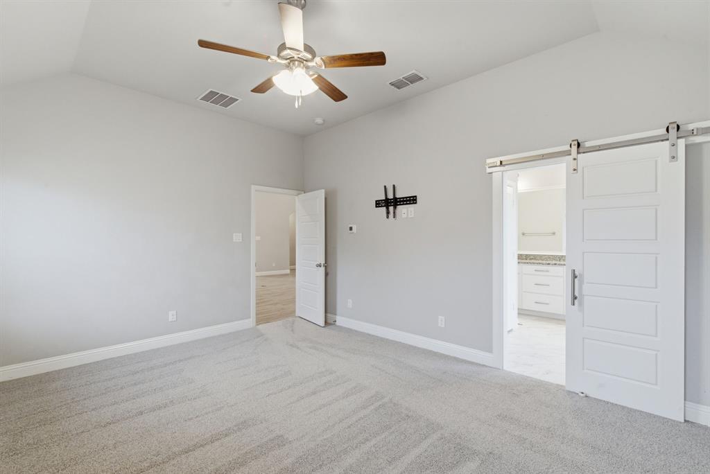 972 Sam Street Springtown, TX 76082 - Photo 15 of 34 an empty room with closet and windows