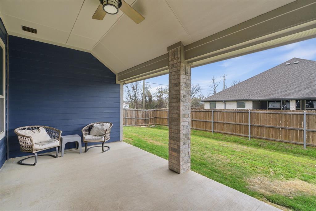 972 Sam Street Springtown, TX 76082 - Photo 2 of 34 a view of a livingroom with furniture and a yard
