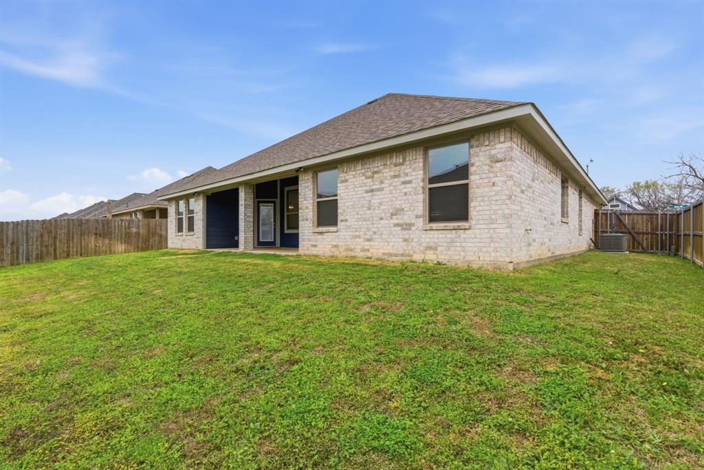 972 Sam Street Springtown, TX 76082 - Photo 4 of 34 a front view of house with yard and green space
