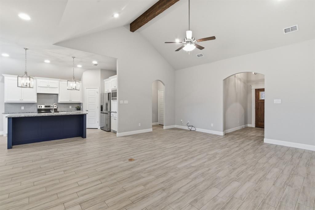 972 Sam Street Springtown, TX 76082 - Photo 8 of 34 a view of kitchen with refrigerator and window