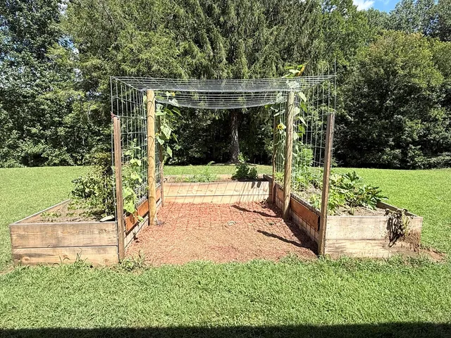 a view of a backyard with sitting area