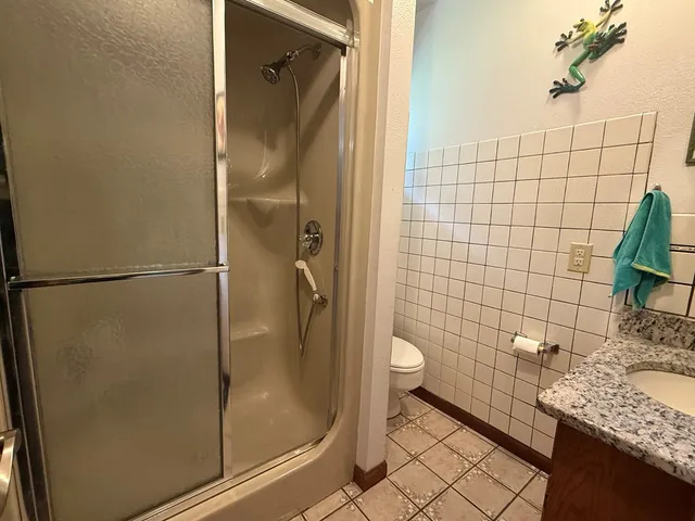 a bed sitting in a room next to a window