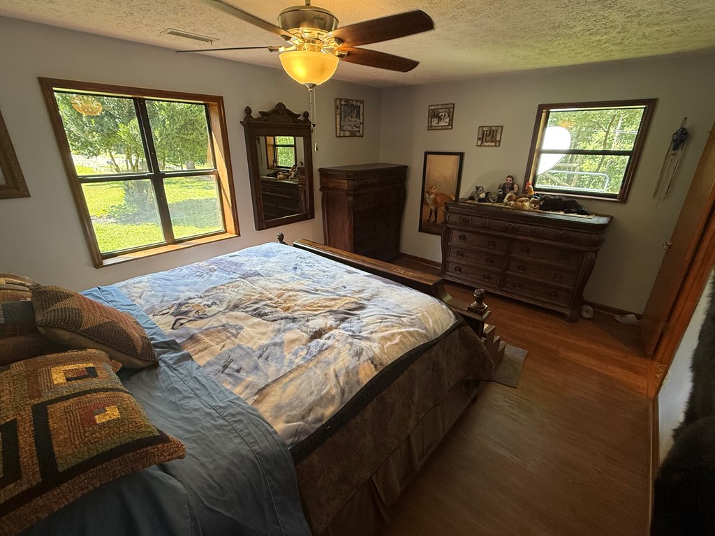 10809 Beaver Dam Road Murphy, NC 28906 - Photo 22 of 46 a bed sitting in a bedroom next to a window