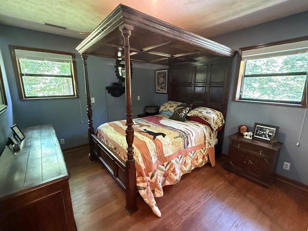 10809 Beaver Dam Road Murphy, NC 28906 - Photo 26 of 46 a bed sitting in a bedroom next to a window