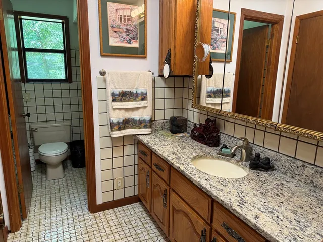 a bathroom with a shower and a sink