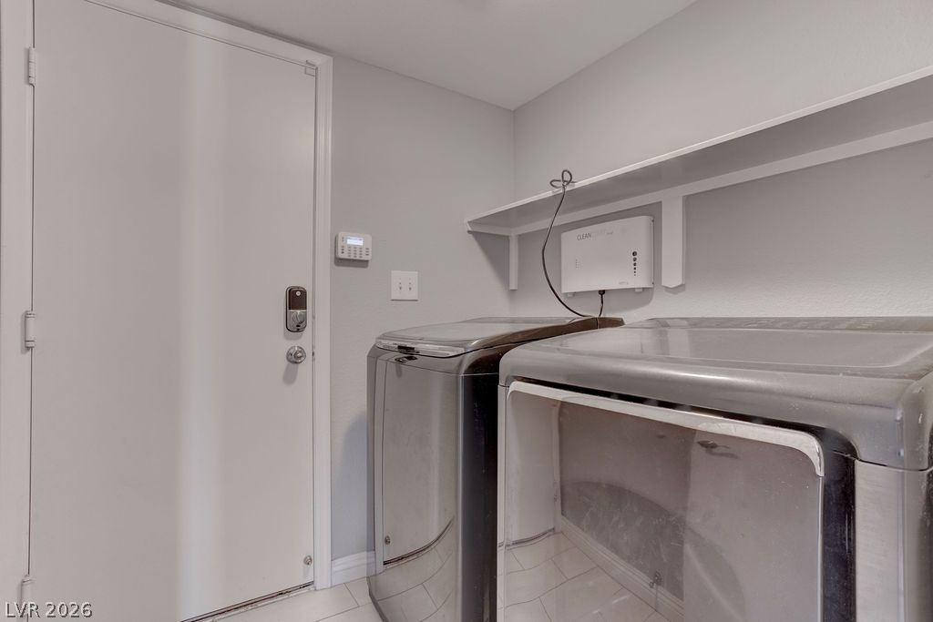 1416 Walstone Road North Las Vegas, NV 89031 - Photo 24 of 47 A well-appointed laundry area offers convenient household maintenance with practical shelving.