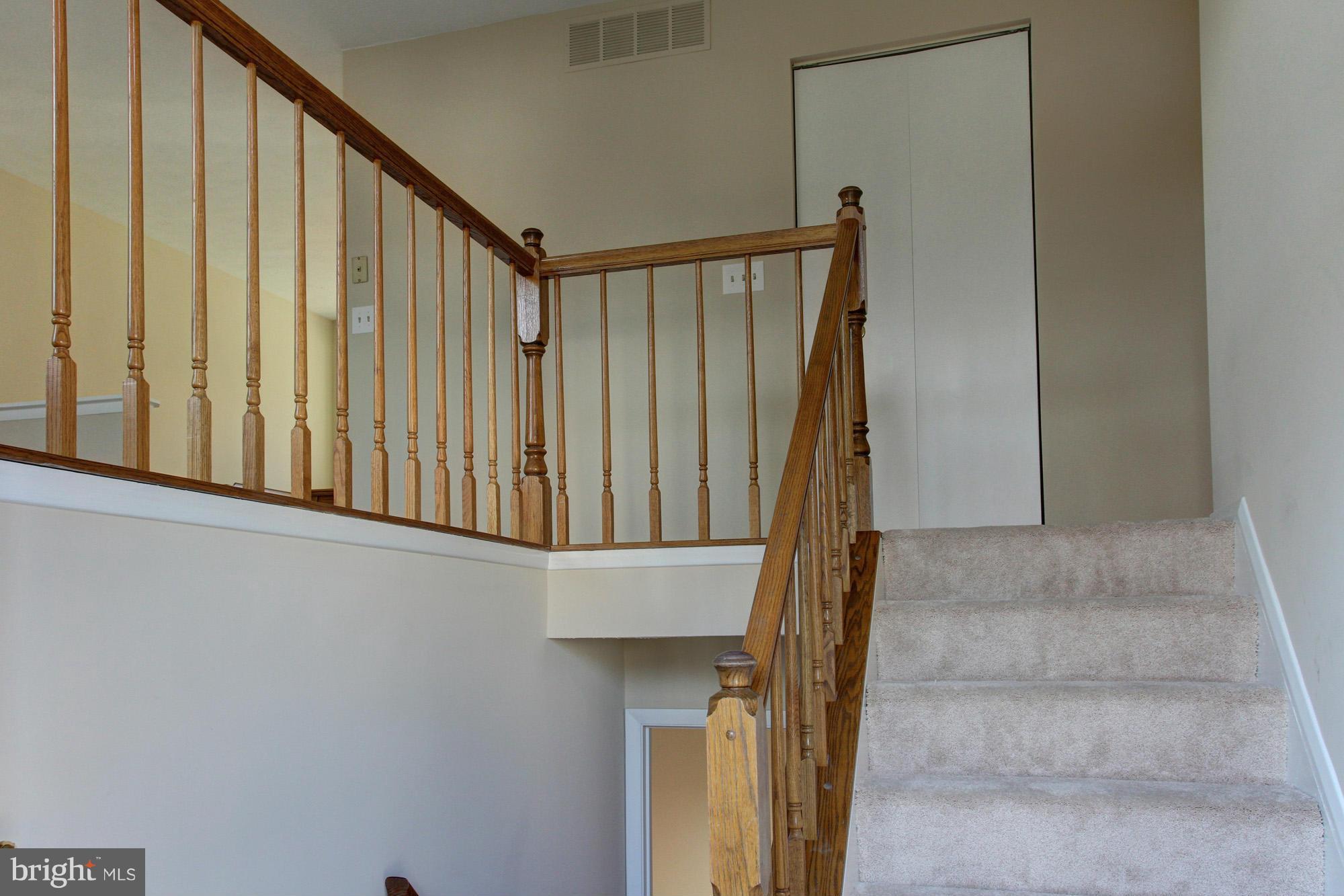 8015 Pine Ridge Road Pasadena, MD 21122 - Photo 2 of 17 open stairway and foyer