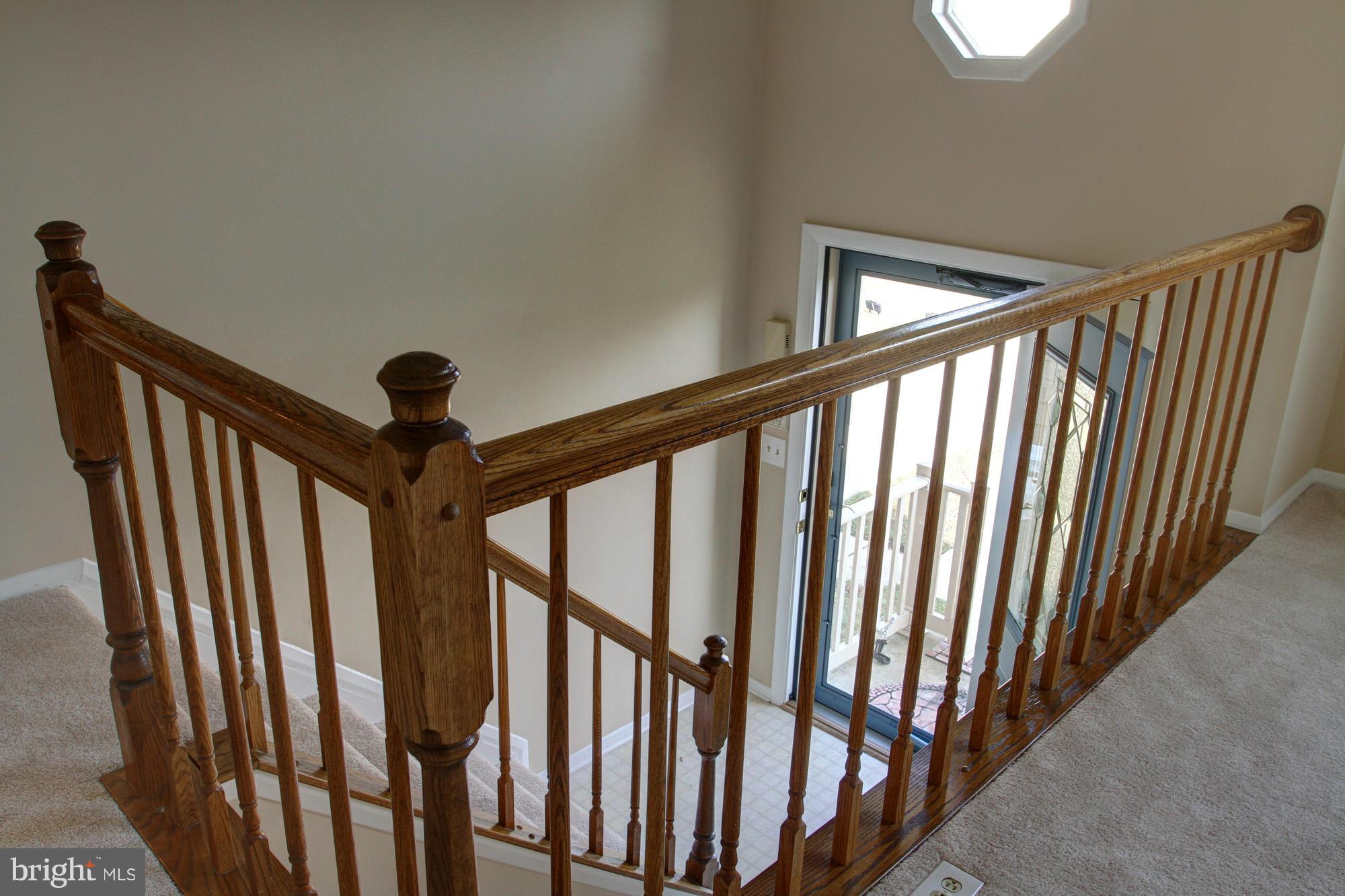 8015 Pine Ridge Road Pasadena, MD 21122 - Photo 3 of 17 open stairway and foyer