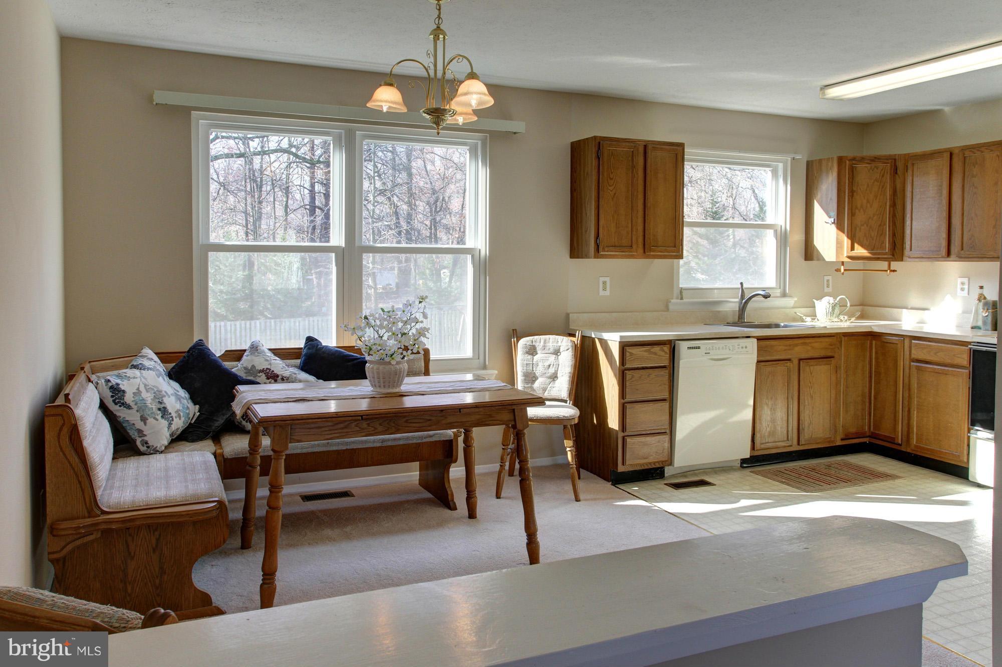 8015 Pine Ridge Road Pasadena, MD 21122 - Photo 6 of 17 Dining area with built in benches for seating