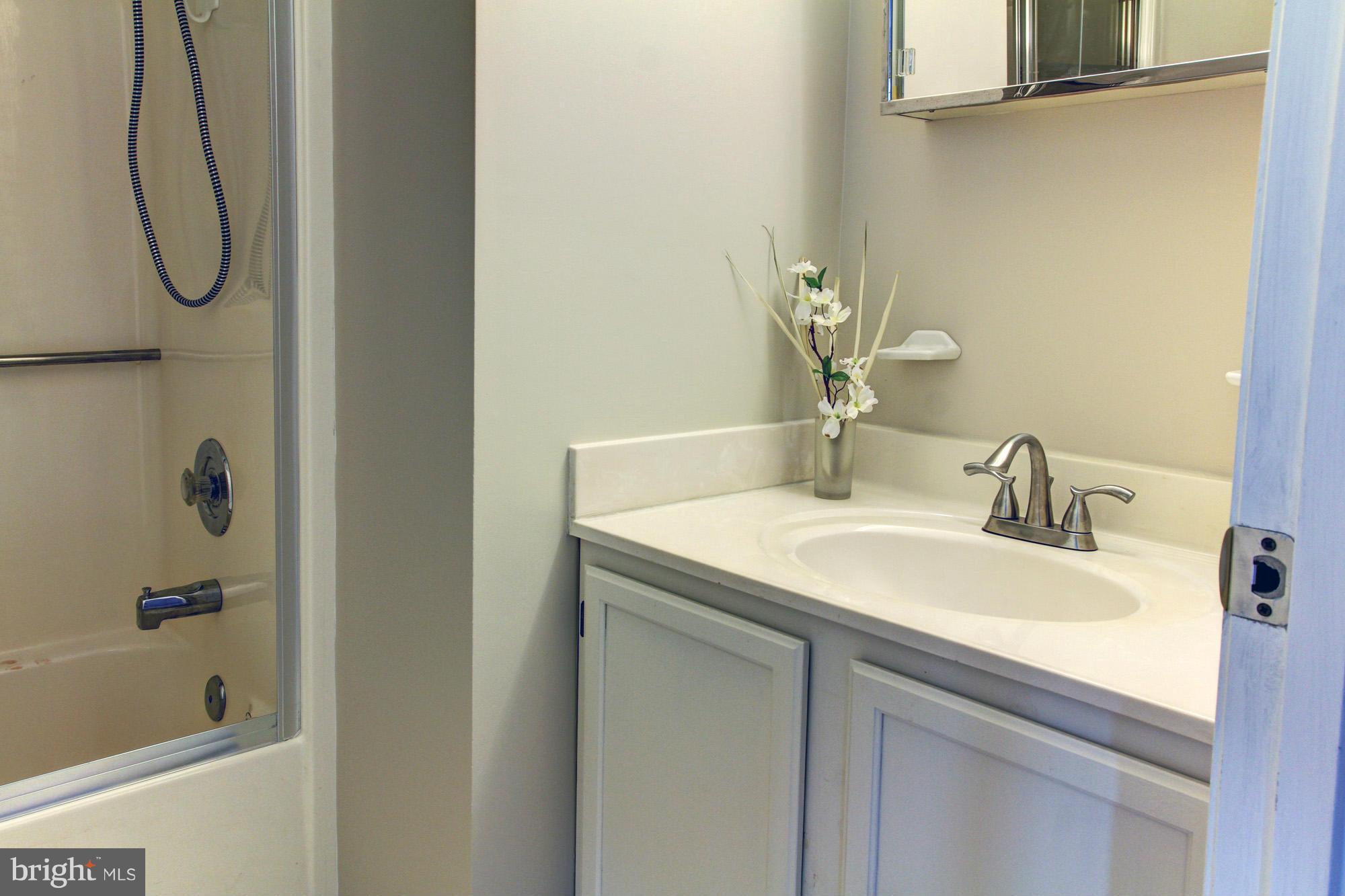 8015 Pine Ridge Road Pasadena, MD 21122 - Photo 8 of 17 hall Bath