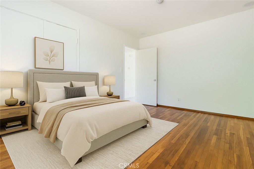 5923 Tyler Street Riverside, CA 92503 - Photo 14 of 19 a bedroom with a bed and a painting on the wall