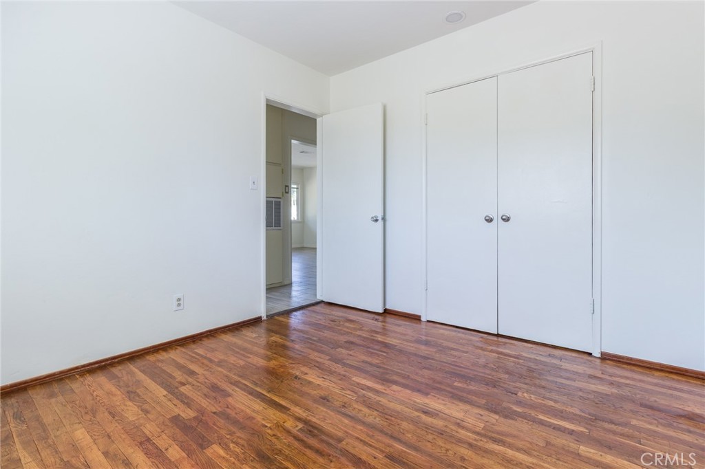 5923 Tyler Street Riverside, CA 92503 - Photo 15 of 19 a view of an empty room with wooden floor