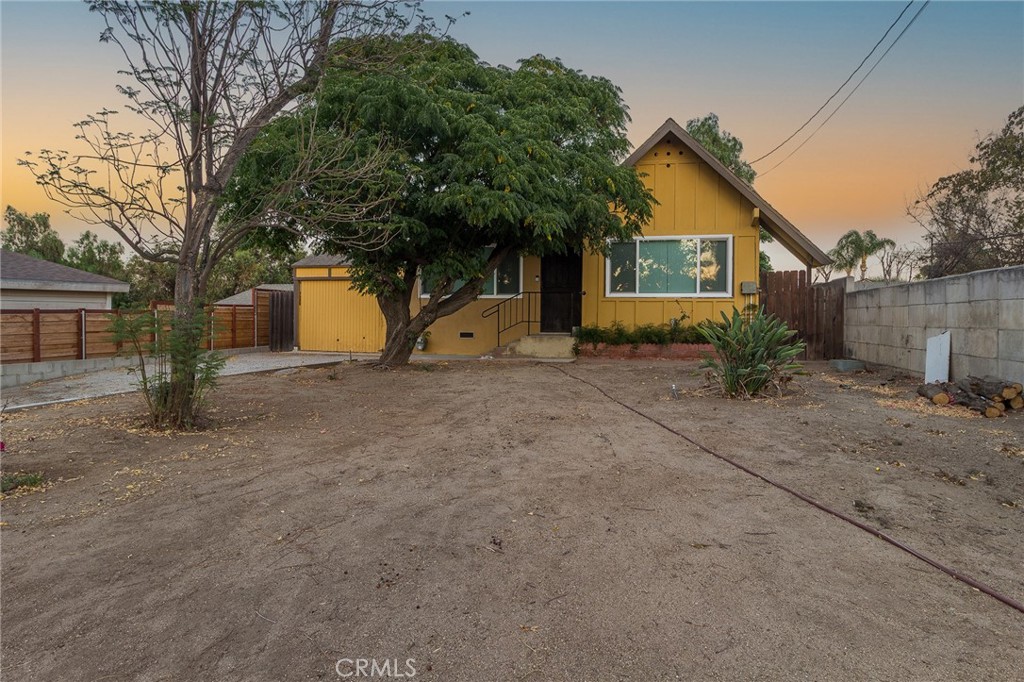 5923 Tyler Street Riverside, CA 92503 - Photo 18 of 19 a view of a house with a yard