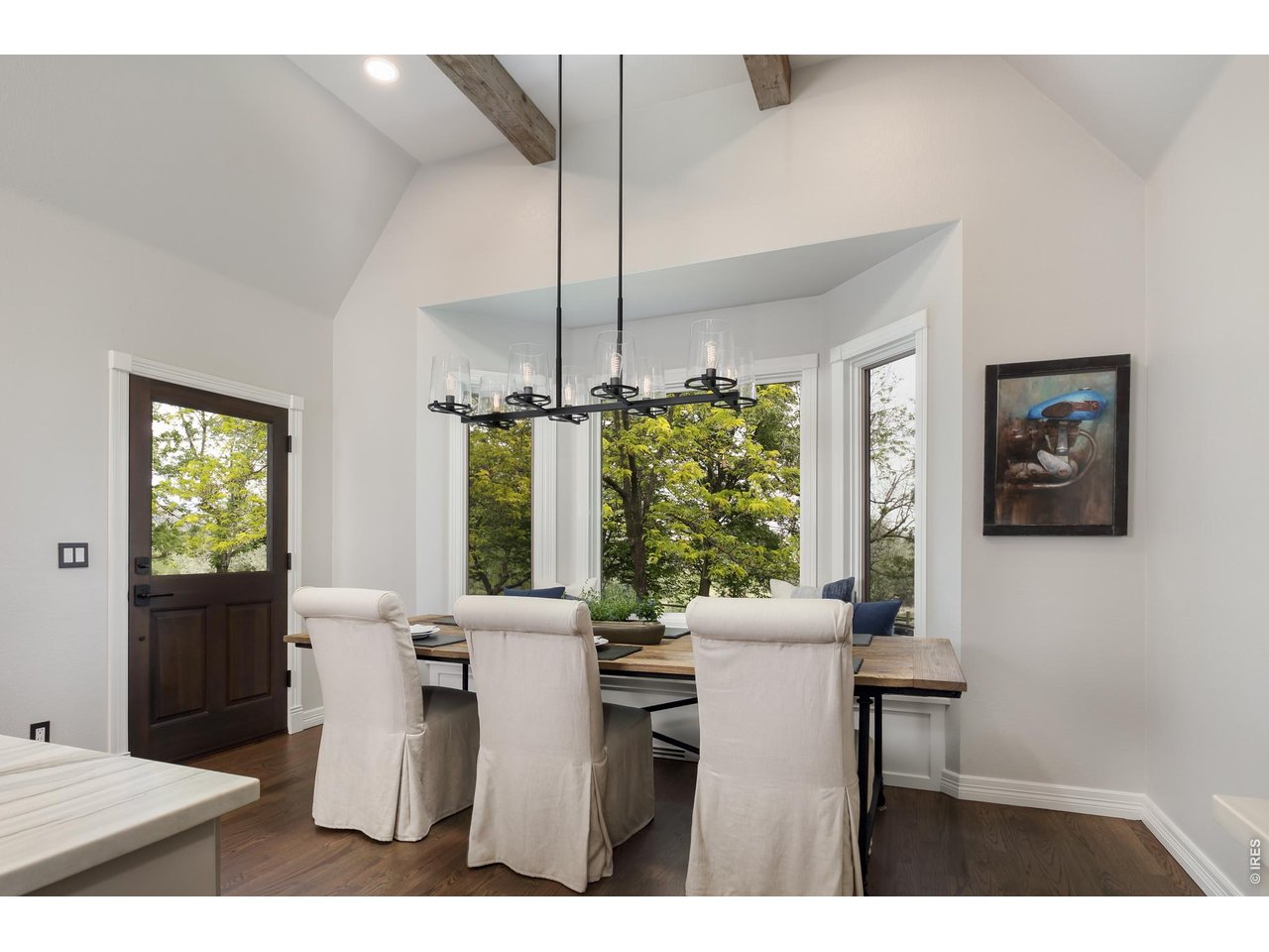 5575 St Vrain Road Longmont, CO 80503 - Photo 15 of 50 Kitchen and dining lead to deck for seamless entertaining