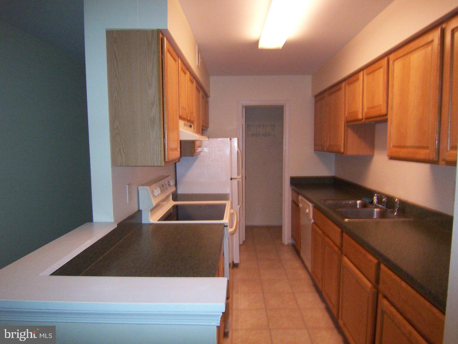 5905 Bayshire Road, Unit 187 Springfield, VA 22152 - Photo 6 of 13 Kitchen with a large pantry at the end