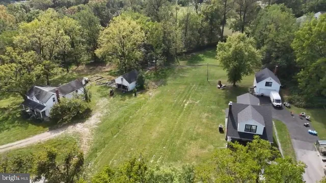 an aerial view of houses with yard