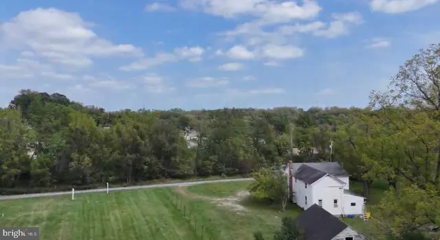 an aerial view of houses with yard