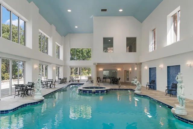 a large kitchen with stainless steel appliances granite countertop a sink and a stove