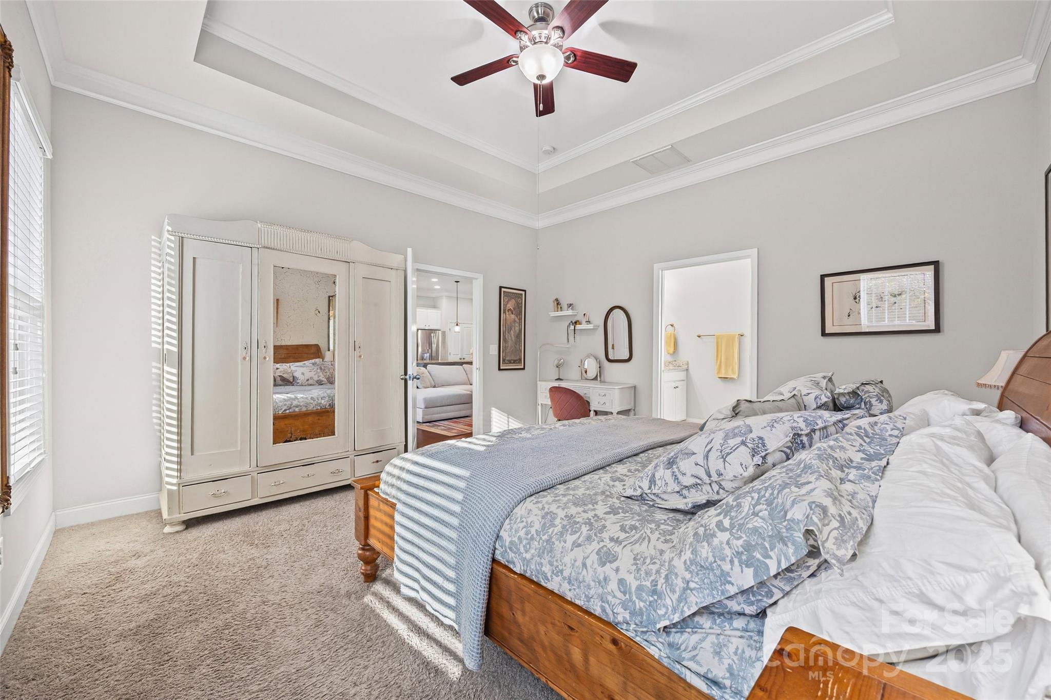 1541 Hedge Apple Road Clover, SC 29710 - Photo 26 of 48 a spacious bedroom with a bed a dresser and a chandelier