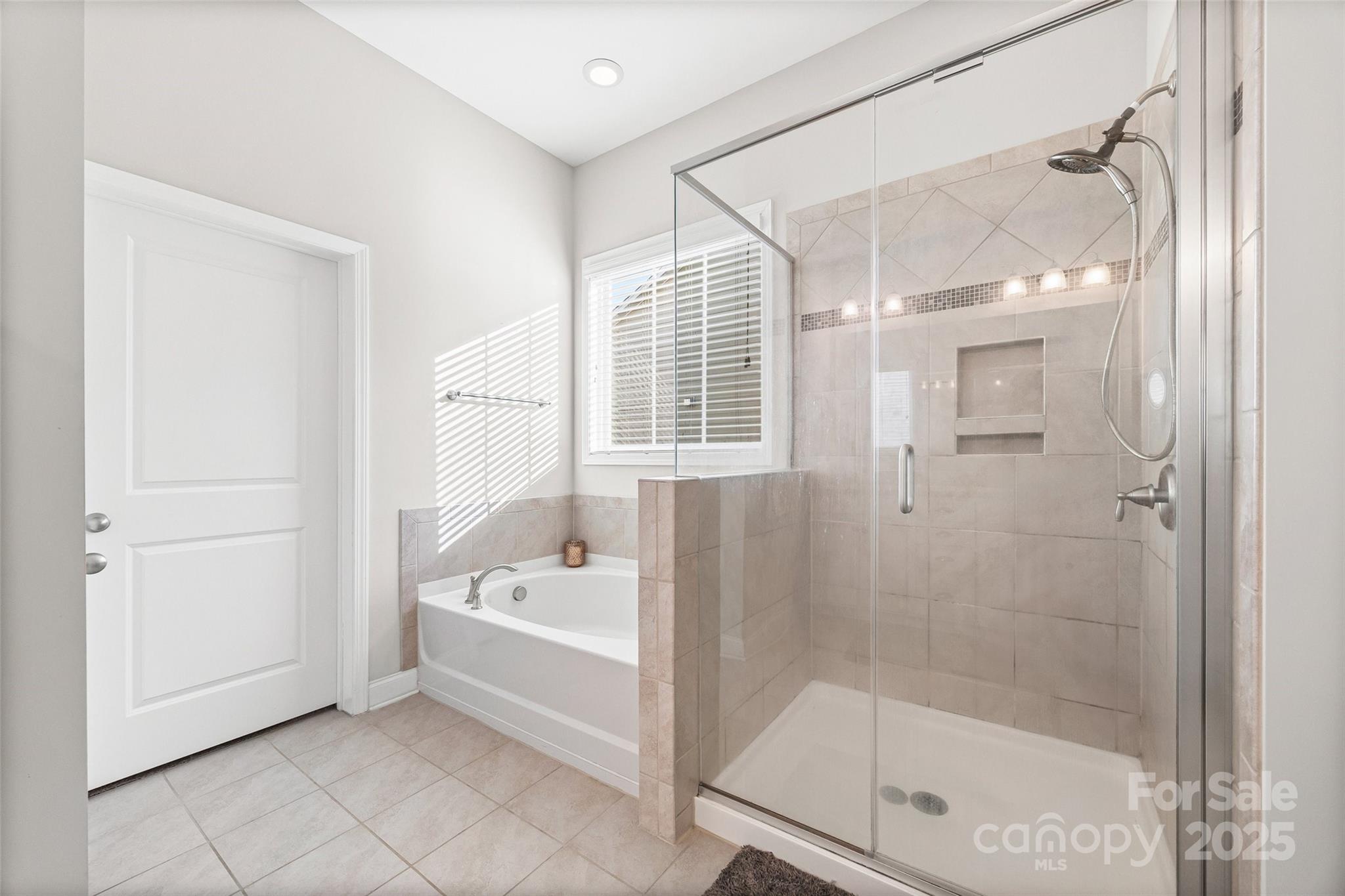 1541 Hedge Apple Road Clover, SC 29710 - Photo 28 of 48 a bathroom with a tub a mirror and a shower