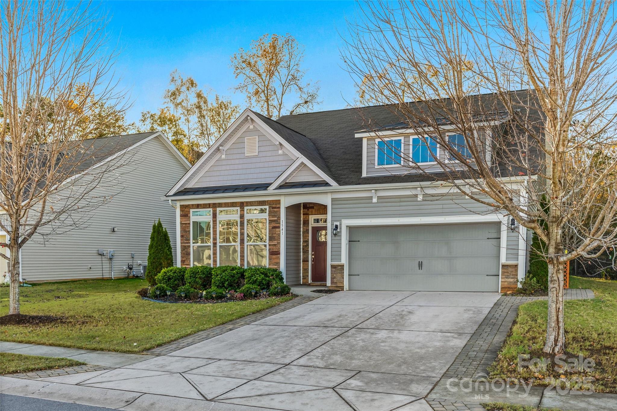 1541 Hedge Apple Road Clover, SC 29710 - Photo 3 of 48 a front view of a house with garden