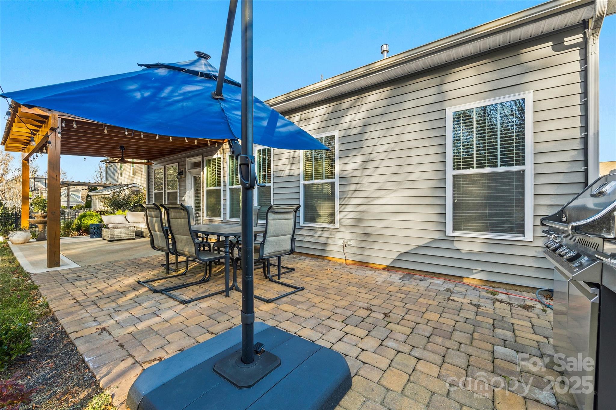 1541 Hedge Apple Road Clover, SC 29710 - Photo 34 of 48 a view of a patio with a table chairs and backyard