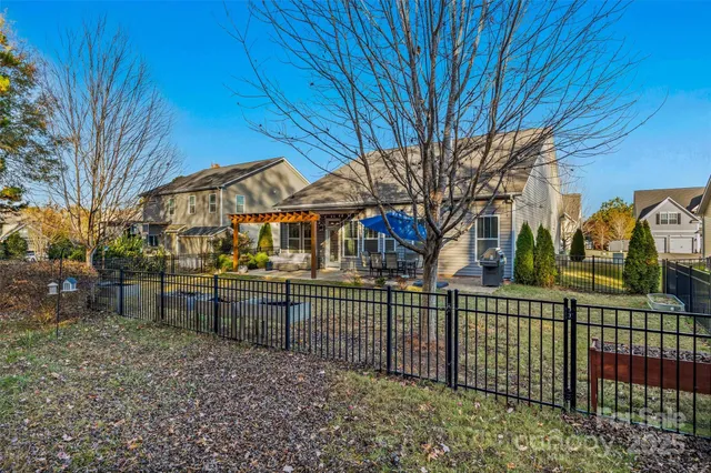 a view of a wrought iron fences in front of house