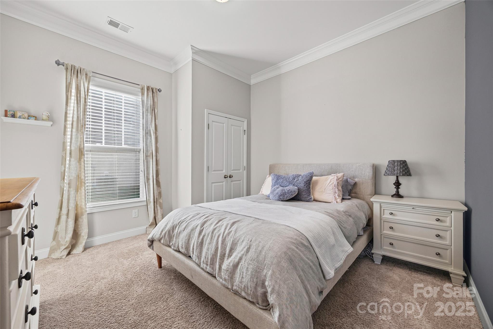 1541 Hedge Apple Road Clover, SC 29710 - Photo 7 of 48 a bedroom with a bed and a window