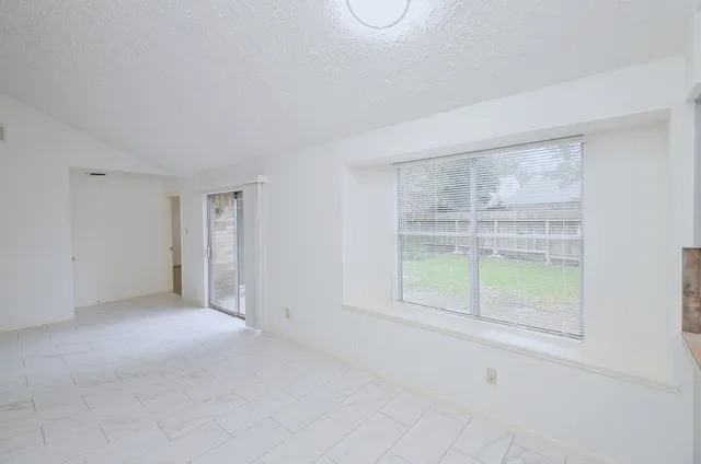 a kitchen with a sink stove and refrigerator