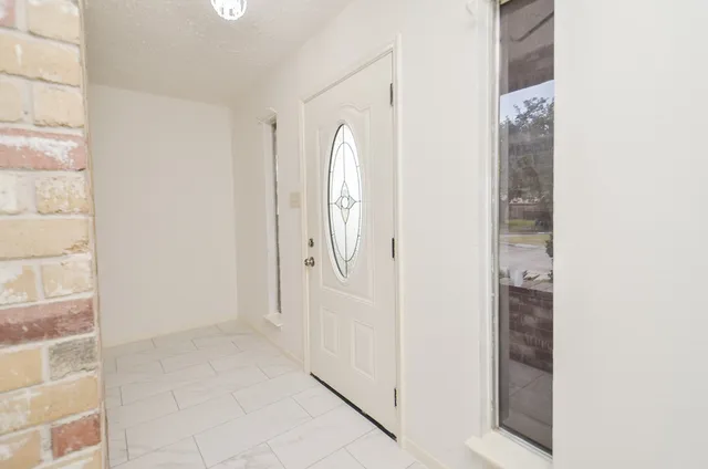 a bathroom with a glass shower door
