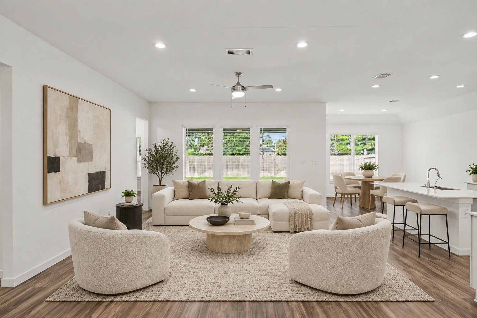 14162 Primrose Ridge Lane Conroe, TX 77384 - Photo 12 of 48 Experience modern elegance in this beautifully staged open-concept living space, featuring sleek design and abundant natural light, perfect for entertaining and relaxation.