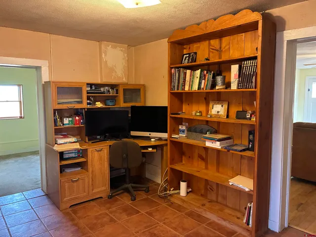 a view of a workspace with furniture