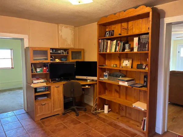 a view of a workspace with furniture