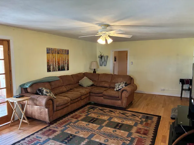 a living room with furniture and a rug