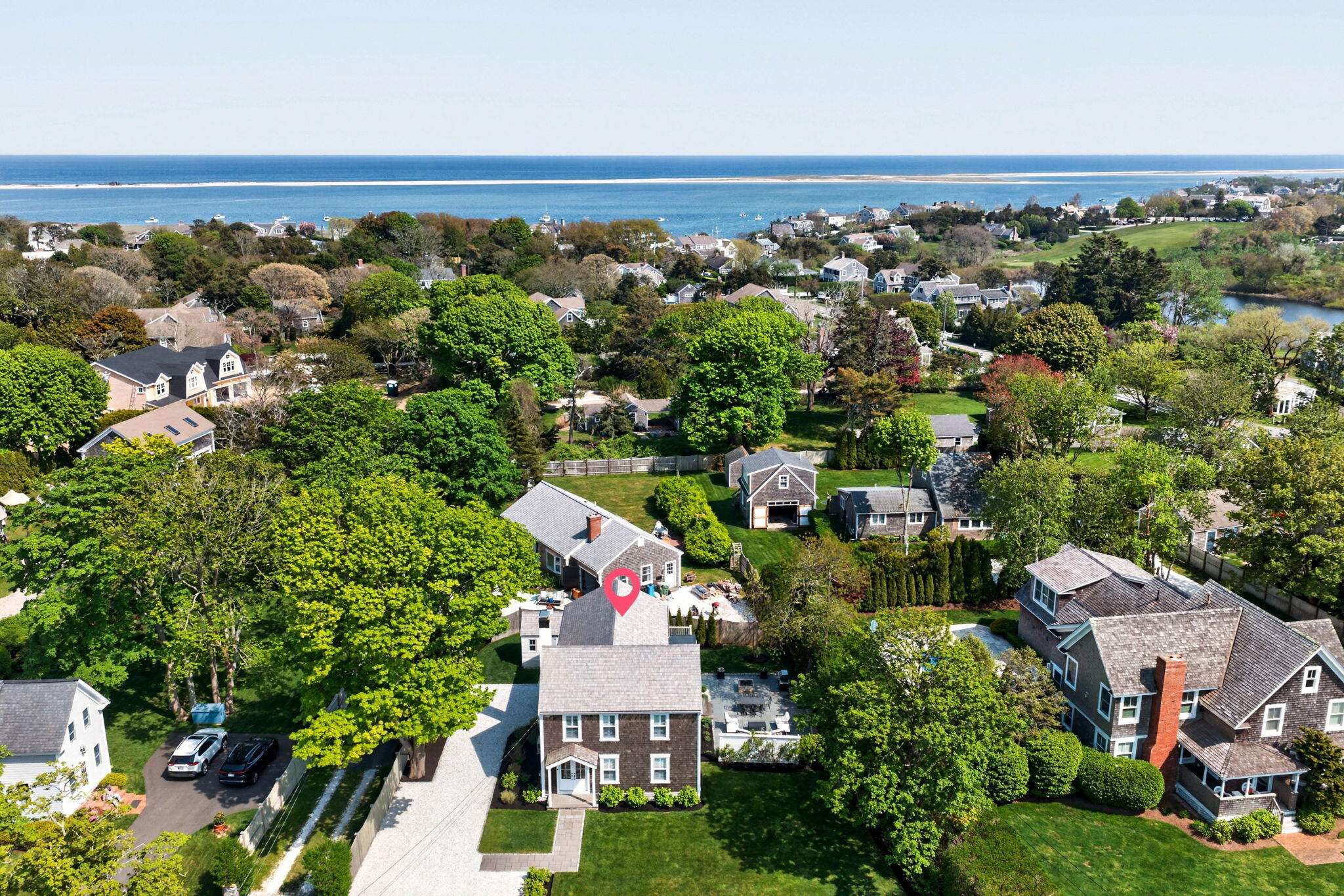 320 Old Harbor Road Chatham, MA 02633 - Photo 2 of 58 an aerial view of a house with a yard lake and outdoor seating