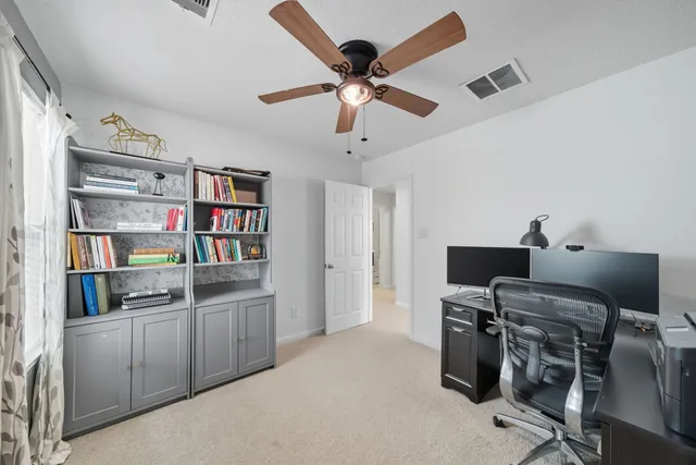 a view of a workspace with furniture