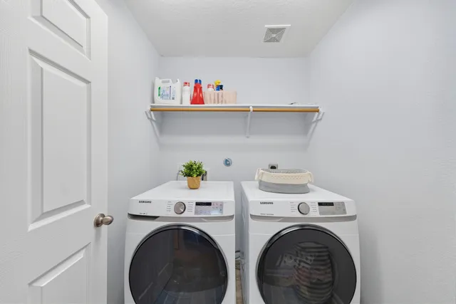 a utility room with dryer and washer
