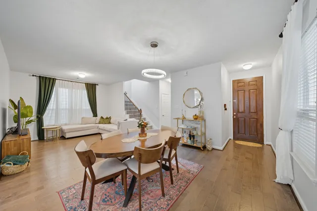 a view of a dining room with furniture window and wooden floor
