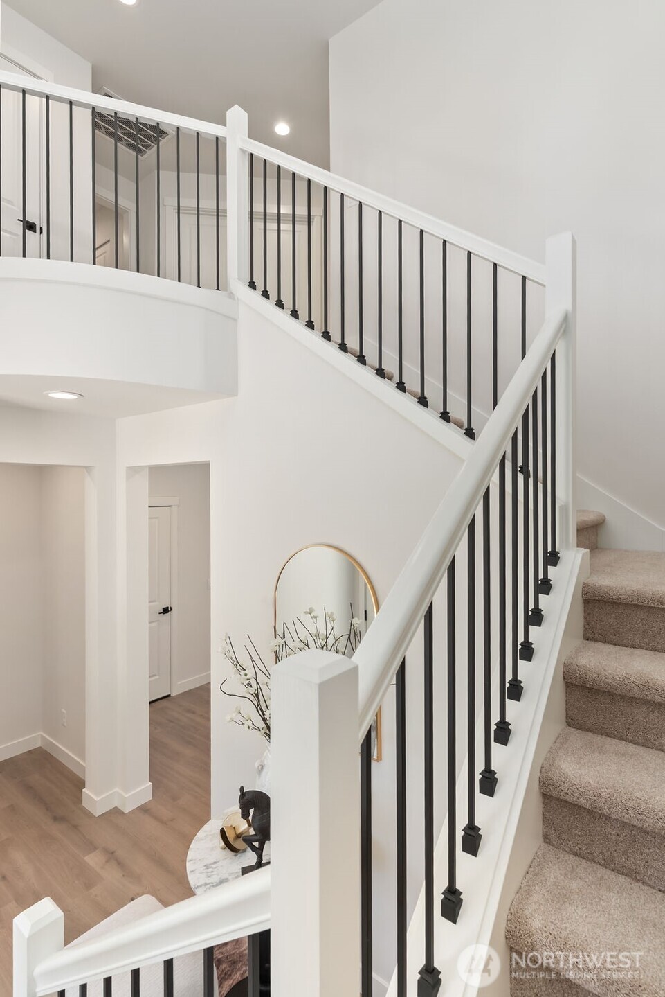1720 South Tyler Street Tacoma, WA 98405 - Photo 12 of 14 a view of staircase with lots of frames on wall and a chandelier