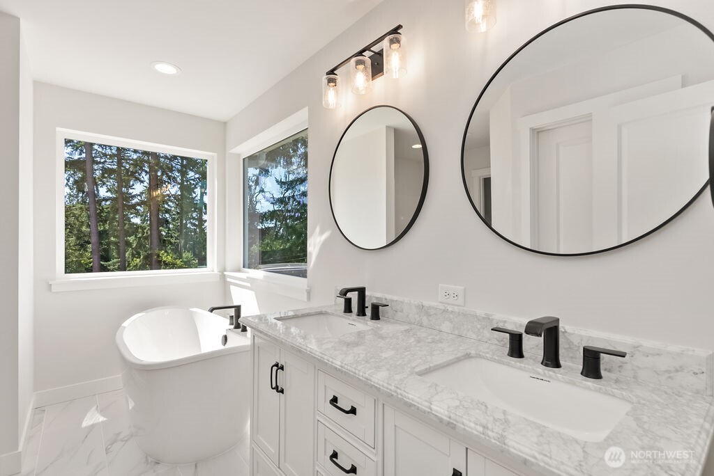 1720 South Tyler Street Tacoma, WA 98405 - Photo 13 of 14 a bathroom with a sink and a mirror