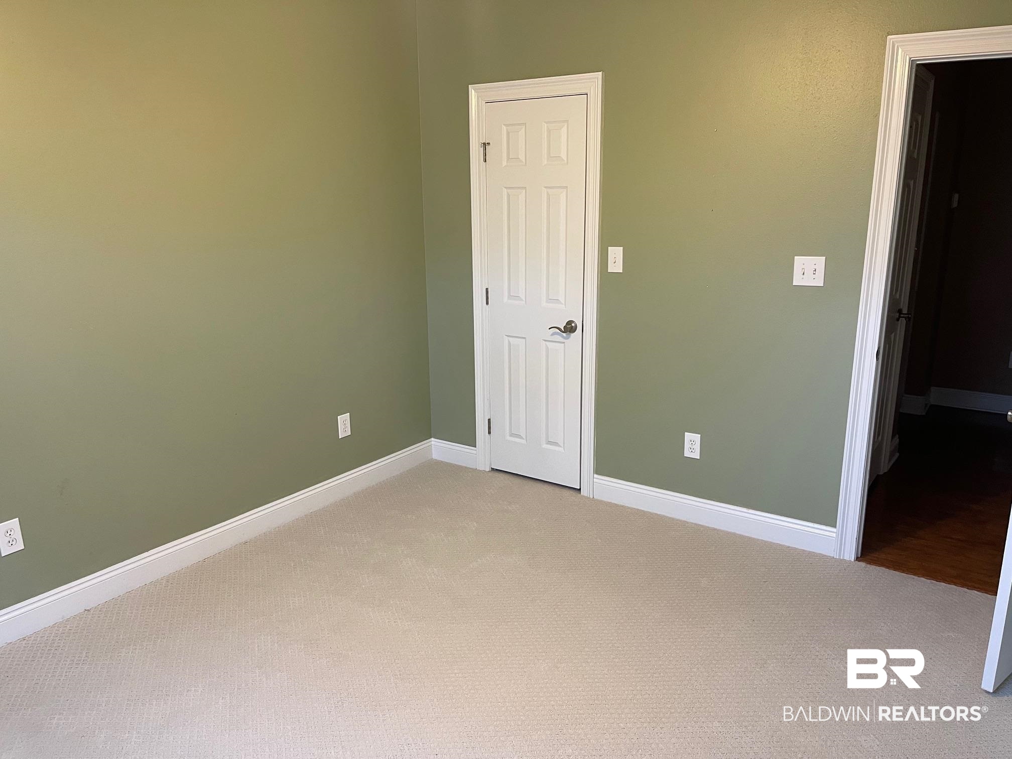 109 Savannah Circle Foley, AL 36535 - Photo 17 of 17 Unfurnished bedroom featuring light carpet