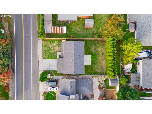 a view of a house with a yard and sitting area